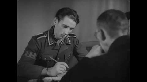 German interrogate fills their mobilization papers - 1946 Stock Footage 91595959