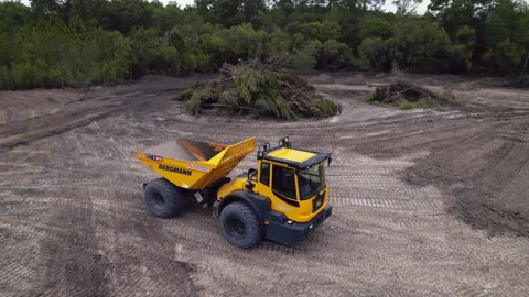 A German made Bergmann C815S driving across a construction site in the U.S Stock Footage 152797622