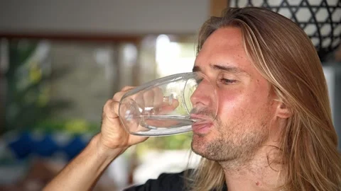 German man drinking water close up. Thirsty person quench thirst. Morning habit. Stock Footage 236699117