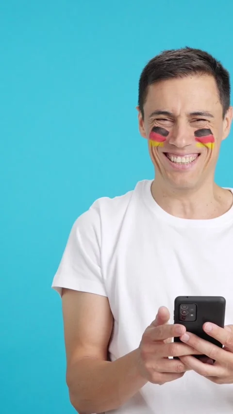 German man looking at his mobile smiling and showing it. Stock Footage 261387854