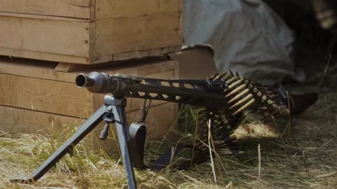 German MG34 Machine Gun Positioned with Ammo Belt at WWII reconstruction Site Stock Footage 306367067