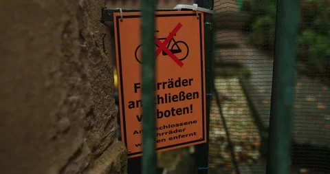 German no bikes allowed warning sign in residential area during fall season Stock Footage 230487234
