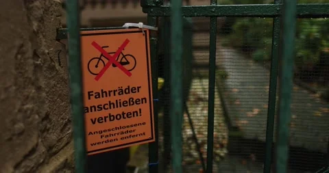 German no bikes warning sign in old residential area during fall season Stock Footage 230487441