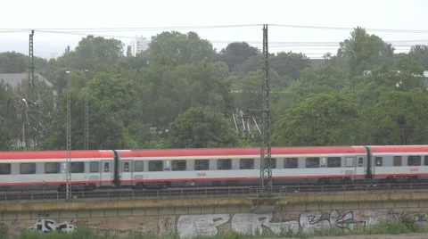 German passenger train pass rainy day storm rain day people commute travel trip  Stock Footage 45909915