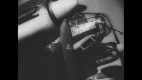 German planes are loaded with bombs and a surveillance plane offloads its camera Stock Footage 103388323