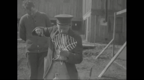 German prisoner fixing a iron stand Stock Footage 43317953