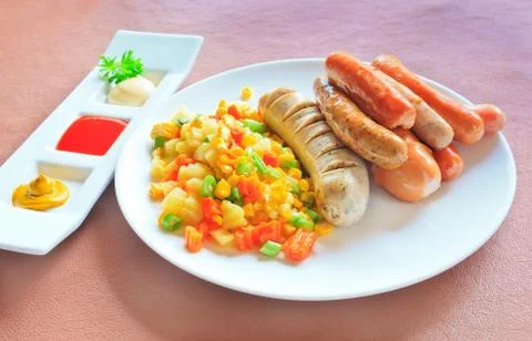 German sausage with salad Stock Photos
