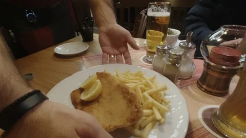 German Schnitzel arriving at the table Stock Footage 126363247