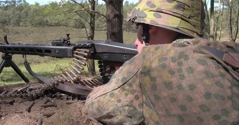 German soldier checking and loading gun and shooting a mg42 Stock Footage 85223621