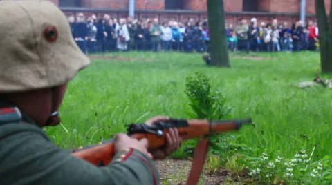 German soldier of first world war shoots from mashine-gun on the historical show Stock Footage 65676761