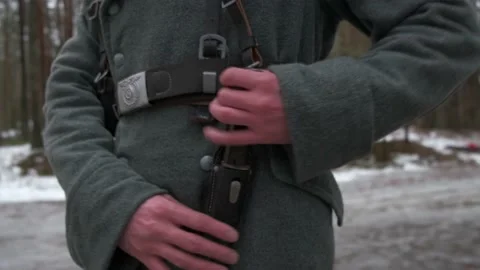 German soldier of the Second World War, pulls out a bayonet knife Stock Footage 220714516