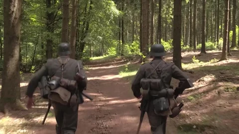 German SS Squad running through European Forest during World War 2 Stock Footage 325352347