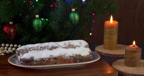 German Stollen cake on a Christmas table with candles. Stock Footage 282801009