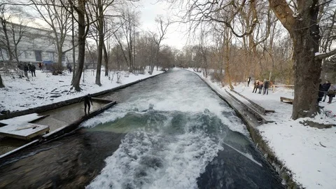 German surfer jumps on board in river and falls in wave at Munich park Stock Footage 120986809