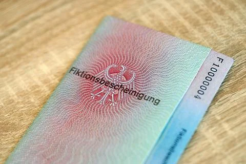 German temporary Permanent resident card lies on wooden table Stock Photos