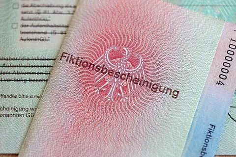 German temporary Permanent resident card lies on wooden table Stock Photos