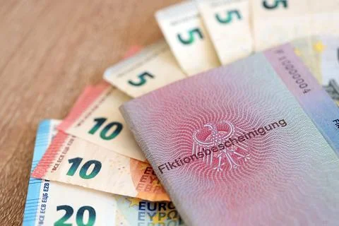 German temporary Permanent resident card specimen and euro money bills Stock Photos