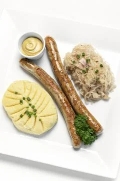 German thuringer sausage with mashed potato and sauerkraut meal Stock Photos