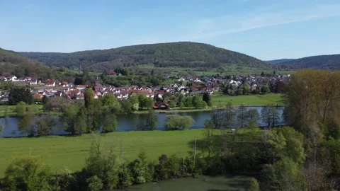 German town between the hills across the river Stock Footage 154370122