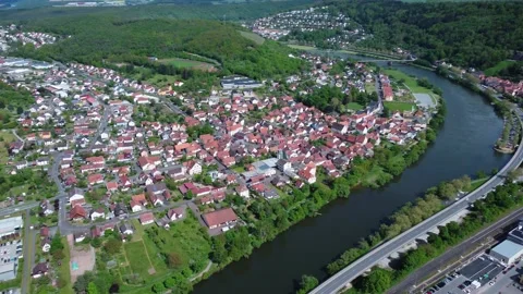 A german town next to a river from above Vídeos de archivo 154416269