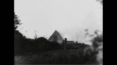 German warehouse burning in battlefield Stock Footage
