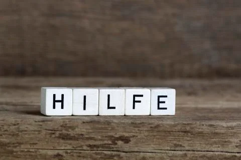 German word help, written in cubes Stock Photos