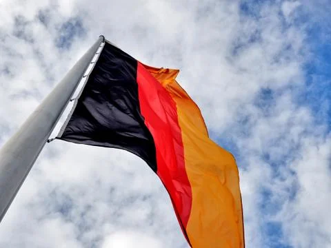 Germana Waving Flag with Cloudy Sky Background Stock Photos