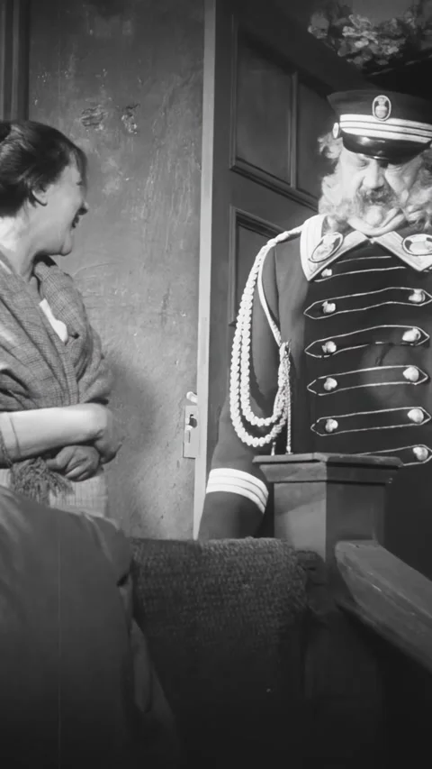 GERMANY - 1924 - in this silent comedy, a drunk doorman leaves his apartment and Stock Footage 339809722