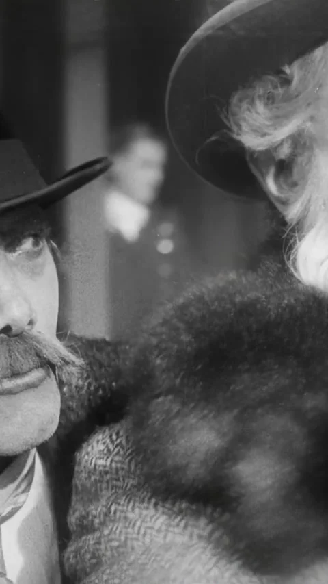 GERMANY - 1924 - in this silent comedy, a man leaves a hotel and gets into a Stock Footage 339808905