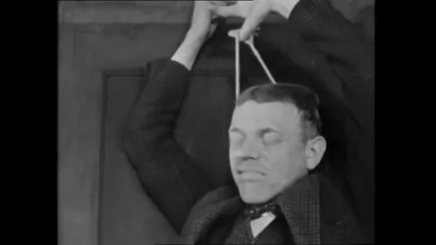 GERMANY - 1929 - In this silent comedy, a man tries and fails to commit suicide. Stock Footage 304429585
