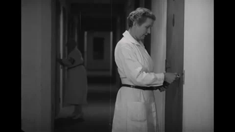 GERMANY - 1936 - in this documentary, a female prison guard opens a cell and Stock Footage 337948640