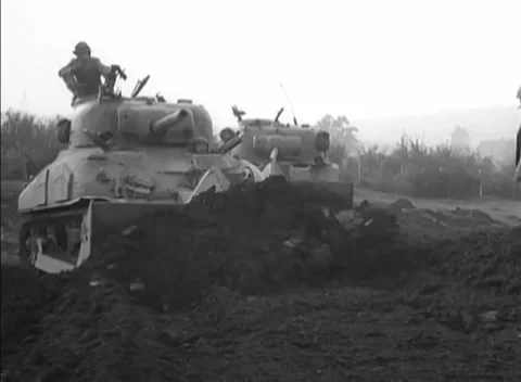 GERMANY - 1944: Dozer team - Paired Tank Dozers Work the Breach Ground Stock Footage 344493675