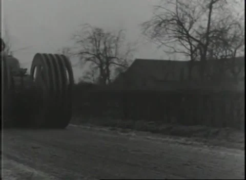 GERMANY - 1944: Mine clearing - Heavy mine rollers cross a muddy road Stock Footage 343849120