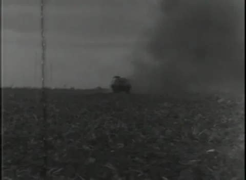 GERMANY - 1944: Mine clearing - Tracked vehicle passes blast smoke 库存影片 343849096