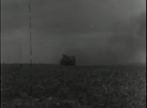 GERMANY - 1944: Mine clearing - Tracked vehicle crosses blast haze Stock Footage 343849099