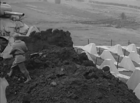GERMANY - 1944: Siegfried Line crossing - Tank dozer builds an obstacle crossing Video stock 344493837