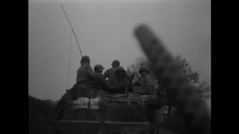 GERMANY - 1945 - 11th Armored Division soldiers drive M-26 Pershing tanks Stock Footage 296689627