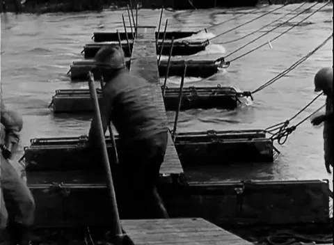 GERMANY - 1945: Alignment - Engineer Holds a Pole on the Pontoon Treadway Stock Footage 344494404