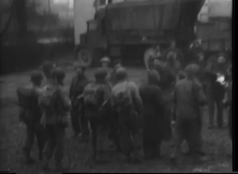 GERMANY - 1945: Allied Advance - Packed Troops Beside Cargo Trucks Stockbeeldmateriaal 343942453