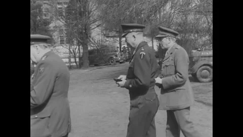 GERMANY - 1945: Allied headquarters visit - Officers Study Field Papers Stock Footage 343849992
