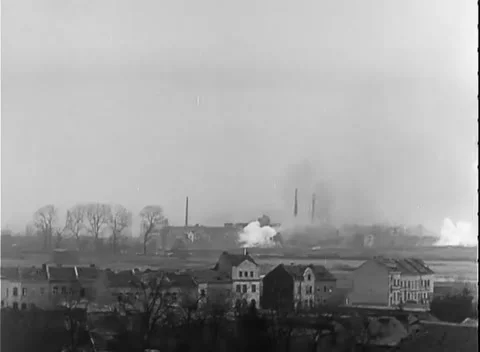 GERMANY - 1945: Artillery strike - Shell burst rises over shattered skyline Stock-Footage 344494579