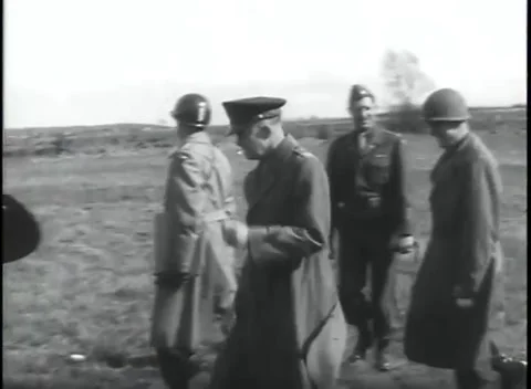 GERMANY - 1945: Bare tree skyline - An officer walks between two escorts Stock Footage 344598421