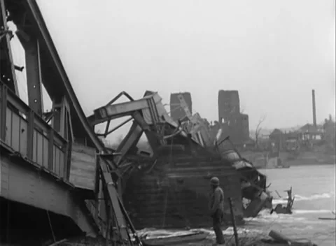 GERMANY - 1945: Bridge Collapse - Bent Deck Drops Toward the River Stock Footage 343942532