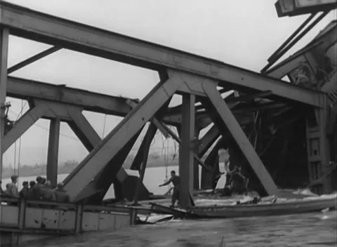 GERMANY - 1945: Bridge Collapse - Crews Work Above Churning Water Stock Footage 343942538