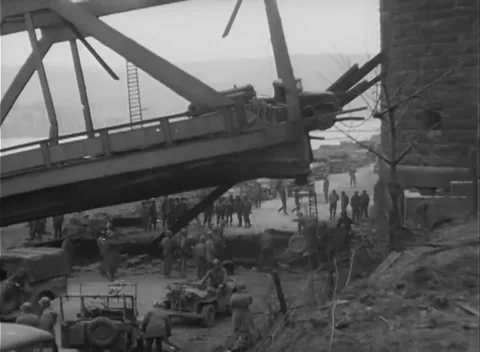 GERMANY - 1945: Bridge Collapse - Jeeps Below the Buckled Truss Stock Footage 343942522