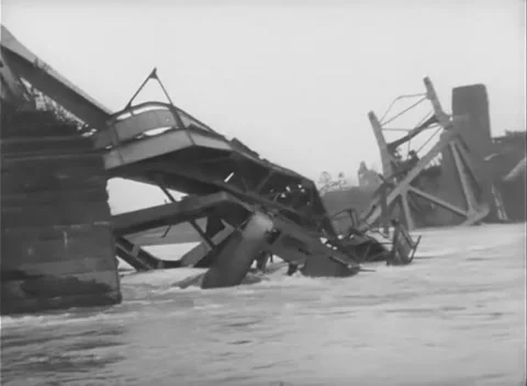 GERMANY - 1945: Bridge Collapse - Lone Soldier Above Folded Steel Stock Footage 343942515
