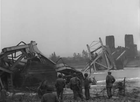 GERMANY - 1945: Bridge Collapse - Traffic Passes Under Standing Steel Stock Footage 343942541