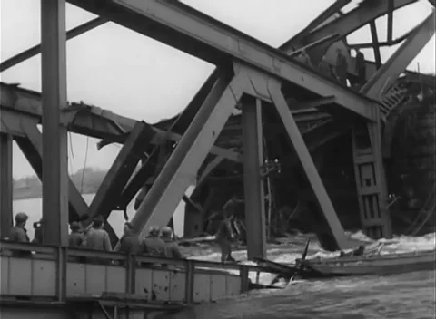 GERMANY - 1945: Bridge Collapse - Watchers Line the Surviving Rail Stock Footage 343942536