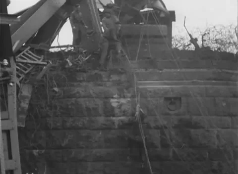 GERMANY - 1945: Bridge Collapse - Workers Cross the Crushed Lattice Stock Footage 343942547