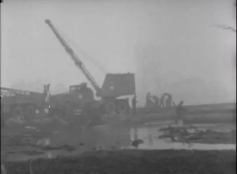 GERMANY - 1945: Bridge construction - Engineers stack treadway bridge girders Stock Footage 344493585